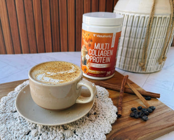 A warm, cozy cup of pumpkin spice latte sitting on top of a saucer. 